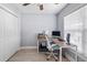 Bright bedroom showcasing an organized workspace with a wooden desk, modern computer, and natural light at 1250 White Tail Path, Charleston, SC 29414