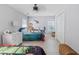' bedroom featuring twin beds, dinosaur wall art, and a ceiling fan, illuminated by natural light at 1250 White Tail Path, Charleston, SC 29414