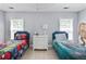 ' bedroom showcasing twin beds, playful superhero bedding, and a central nightstand with a lamp at 1250 White Tail Path, Charleston, SC 29414