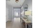 Foyer featuring hardwood floors, neutral walls, and a decorative table with lamps and floral arrangements at 1250 White Tail Path, Charleston, SC 29414