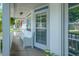 Inviting front porch with a cozy bench, hanging plants, and a view of the neighborhood at 1250 White Tail Path, Charleston, SC 29414