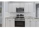 Elegant kitchen with stainless steel appliances, granite countertops and white cabinetry at 1250 White Tail Path, Charleston, SC 29414