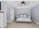 Well-lit main bedroom features fan, light gray walls, and ample space at 1250 White Tail Path, Charleston, SC 29414