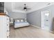 Well-lit main bedroom features fan, light gray walls, and ensuite bathroom access at 1250 White Tail Path, Charleston, SC 29414