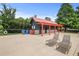 Outdoor pool area featuring a restroom building, lounge chairs, and well-maintained concrete at 1250 White Tail Path, Charleston, SC 29414