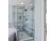 Modern shower with glass enclosure and blue tiled walls at 1250 White Tail Path, Charleston, SC 29414