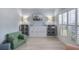Cozy sitting room featuring custom built-in shelving, recessed lighting and plantation shutters at 1250 White Tail Path, Charleston, SC 29414