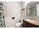 Cozy bathroom featuring a framed mirror, neutral walls, and shower with a decorative curtain at 130 Shropshire St, Goose Creek, SC 29445