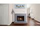 Cozy living room fireplace with charming decor, hardwood floors and natural light at 130 Shropshire St, Goose Creek, SC 29445