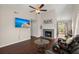 Inviting living room with a cozy fireplace, hardwood floors, and natural light at 130 Shropshire St, Goose Creek, SC 29445