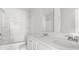 Clean bathroom with double sinks, white cabinets and a bathtub shower combo at 133 Brant Dr, Summerville, SC 29483