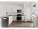 Modern kitchen featuring stainless steel appliances, granite countertops, and white cabinetry at 133 Brant Dr, Summerville, SC 29483