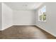 Well-lit room featuring pristine white walls, decorative moulding and dark wood floors at 133 Brant Dr, Summerville, SC 29483
