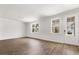 Bright living room with gleaming hardwood floors and large windows offering plenty of natural light at 133 Brant Dr, Summerville, SC 29483