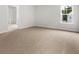 Spacious main bedroom with plush carpeting, bright window and ensuite bathroom at 133 Brant Dr, Summerville, SC 29483