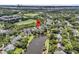 Aerial view of a home nestled within a lush, green neighborhood by a pond at 134 Etiwan Park St, Charleston, SC 29492