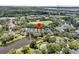 Aerial view of a charming home in a picturesque community with a lake and green spaces at 134 Etiwan Park St, Charleston, SC 29492
