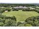 Expansive aerial view showcases community park with athletic field, school building, and lush green landscape at 134 Etiwan Park St, Charleston, SC 29492