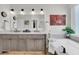 Bright bathroom featuring double sinks, a soaking tub, and modern fixtures and a glass shower at 134 Etiwan Park St, Charleston, SC 29492
