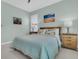 Bright bedroom with beach-themed decor, natural light, and neutral-colored walls and carpet at 134 Etiwan Park St, Charleston, SC 29492