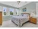 Bright bedroom featuring large windows, light-colored walls, and a floral-patterned bedspread at 134 Etiwan Park St, Charleston, SC 29492