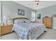 Cozy bedroom with matching nightstands, natural light, and a floral patterned bedspread at 134 Etiwan Park St, Charleston, SC 29492
