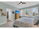 Light and airy bedroom with ceiling fan, light-colored walls, a TV and ensuite bathroom at 134 Etiwan Park St, Charleston, SC 29492