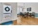Inviting dining area with hardwood floors, stylish lighting fixture, and direct access to the outdoor deck at 134 Etiwan Park St, Charleston, SC 29492