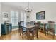 Dining room featuring natural light from the windows, a sleek light fixture, and stylish decor at 134 Etiwan Park St, Charleston, SC 29492