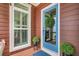 Stylish front door with a glass pane, adorned with a wreath and surrounded by potted plants at 134 Etiwan Park St, Charleston, SC 29492