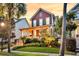 Inviting two-story home with well-manicured lawn, a welcoming porch, and fresh landscaping at 134 Etiwan Park St, Charleston, SC 29492