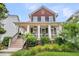 Welcoming two-story home with a charming front porch, complemented by manicured landscaping at 134 Etiwan Park St, Charleston, SC 29492