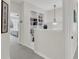 Hallway featuring custom shelving with elegant decor and lighting, leading to the bedrooms at 134 Etiwan Park St, Charleston, SC 29492