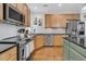 Well-appointed kitchen with stainless steel appliances, a center island, and ample counter space at 134 Etiwan Park St, Charleston, SC 29492