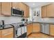 Functional kitchen with stainless steel appliances, granite countertops, and ample cabinet space at 134 Etiwan Park St, Charleston, SC 29492
