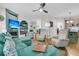 Spacious living room features fireplace and view into the kitchen, as well as hardwood floors at 134 Etiwan Park St, Charleston, SC 29492