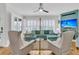 Bright living room with plush seating, hardwood floors, a ceiling fan and a cozy fireplace feature at 134 Etiwan Park St, Charleston, SC 29492