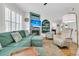 Comfortable living room with a fireplace, hardwood floors, built-in shelving, and ample seating at 134 Etiwan Park St, Charleston, SC 29492