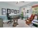 Spacious office with a large desk, comfortable seating, and bright natural light from two windows at 134 Etiwan Park St, Charleston, SC 29492
