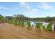Outdoor deck with a long row of green chairs offering poolside community views at 134 Etiwan Park St, Charleston, SC 29492