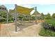 A common picnic area with shaded picnic tables, BBQ and swings at 134 Etiwan Park St, Charleston, SC 29492