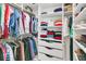 Organized walk-in closet with ample hanging space, shelving, and drawers for storage at 134 Etiwan Park St, Charleston, SC 29492