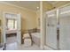 Bright bathroom featuring a glass enclosed shower, jacuzzi tub, and bedroom access at 1454 Carradale Ln, Mount Pleasant, SC 29466
