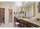 Bright bathroom features dual sinks with granite countertops, tile flooring, and a separate shower room at 1454 Carradale Ln, Mount Pleasant, SC 29466