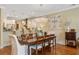 Dining area boasts a stylish chandelier and ample seating, perfect for entertaining at 1454 Carradale Ln, Mount Pleasant, SC 29466