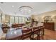Elegant dining room with a large chandelier and stylish furnishings, adjacent to the living area at 1454 Carradale Ln, Mount Pleasant, SC 29466