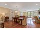 Spacious dining area featuring hardwood floors, a chandelier, and easy access to the living room at 1454 Carradale Ln, Mount Pleasant, SC 29466