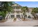 Charming two-story home with double porches, garages, and mature landscaping for curb appeal at 1454 Carradale Ln, Mount Pleasant, SC 29466