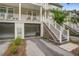 Exterior view of townhomes with driveways, garages and elevated balconies at 1454 Carradale Ln, Mount Pleasant, SC 29466