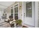 Charming front porch with seating, perfect for relaxing outdoors at 1454 Carradale Ln, Mount Pleasant, SC 29466